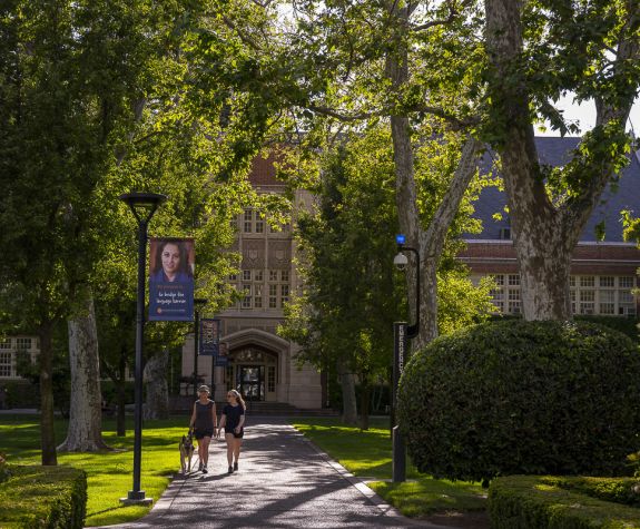 people walking around beautiful campus